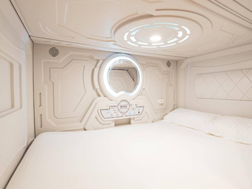 Capsule interior with bed and lighting