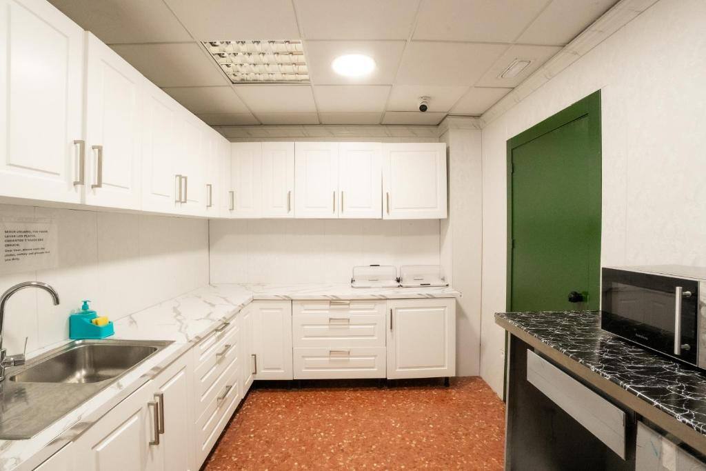 Shared kitchen with microwave and refrigerator